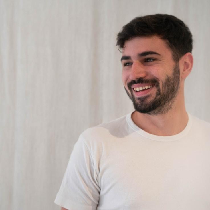 Alex Rivera, Lead Design Curator at Aerindo Phasion, reviewing corporate floral arrangements